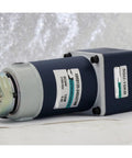 Side view of blue permanent-magnet DC gear motor with brake; 120W, 12/24V, orange output shaft
