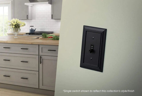Architectural 2-Gang Matte Black Wall Plate With Single Switch And Duplex Combo Cover Zinc Construction For Durability 1 Pack Classic American Style Electrical Outlet Cover mounted on a kitchen wall