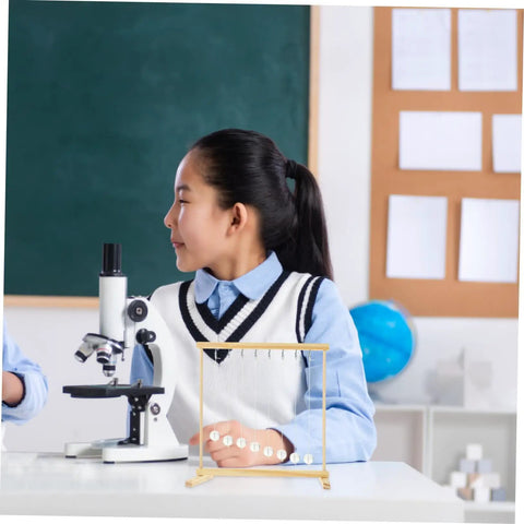 Student using Conservation Of Energy Model Kit For Hands On Pendulum Science Project DIY Snake Shape Prop with wood build