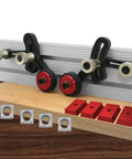 One Way Feeder Stock Guide With Anti Rebound Safety Push Block For Table Saws featuring adjustable miter sliders and red guide blocks.