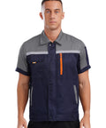 Mens Short Sleeve Work Jacket Built Like A Tank For The Daily Grind With Bright Reflective Stripes And Smooth Front Zip Breathable Auto Mechanic Uniform Gray Navy Blue Contrast, front view.