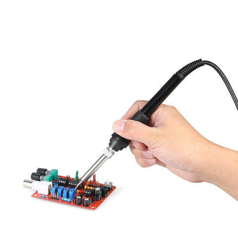 Hand using soldering iron from 2 In 1 Hot Air SMD Soldering Station Rework System With Desoldering Air Gun And Soldering Iron Stand 110V