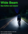 Cyclist riding with Ultra Bright Rechargeable Bike Light CL1000 for Night Rides, illuminating path with wide beam