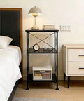 3-Tier Black Storage Shelf With Industrial X-Frame Design beside bed with books, lamp, clock, storage boxes, and glasses