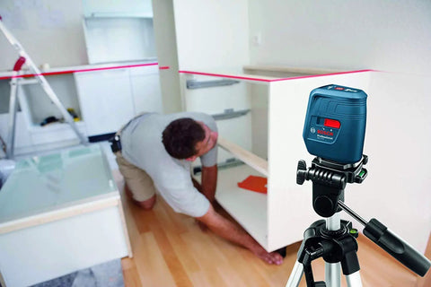 Cross Line Laser Level With 3 Lines, Self Leveling Within 4 Degrees, 15 Meter Range, used for aligning cabinets indoors
