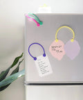 Reusable Silicone Magnetic Cable Ties For Cord Management And Organization 30 Pack on a fridge with notes, multi color set