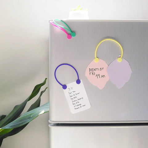 Reusable Silicone Magnetic Cable Ties For Cord Management And Organization 30 Pack on a fridge with notes, multi color set