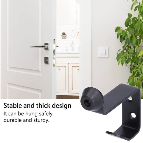 Rock Solid Stainless Steel Door Stopper With Hook, Wall Mounted Door Bumper For Home And Office, Black Finish next to open door