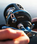 Tough As Nails Saltwater Level Wind Fishing Reel Size Thirty featuring graphite housing and brass main gear in use.