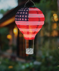 Patriotic Pop-Up Hot Air Balloon Solar Lantern With LED Light weather-resistant metal and polyester outdoor decor glowing at night