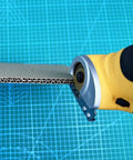 Heavy Duty Replacement Blades For Worx ZipSnip Electric Scissors cutting through cardboard with a rotary cutter.