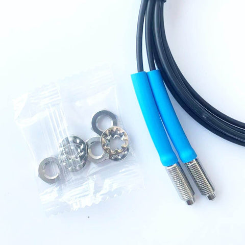 FT610 Diffuse Reflective Optical Fiber Sensor with 1M line, M6 probe, and accessories, shown with rugged TPV housing for industrial use.