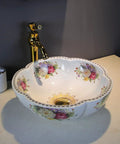Decorative floral porcelain vessel sink with smooth glaze on bathroom vanity; not the Green Flower Round Vessel Sink.