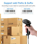 Handheld USB 2D Barcode Scanner Wired Plug And Play Automatic QR Code Reader scanning boxes in a warehouse for inventory management.