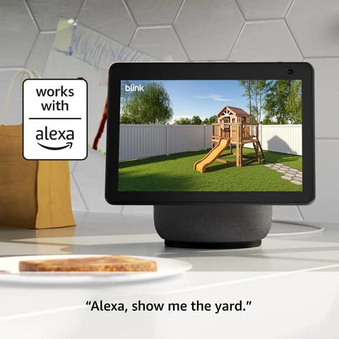 Smart display showing yard view with children's playset, integrates with Full Wireless Outdoor Security Camera Kit And Smart Hardwired Doorbell Package Serving Straight Fire 2K Video All Weather Durable Black Finish Plus Sync Hub Making Home Security A Huge Win.