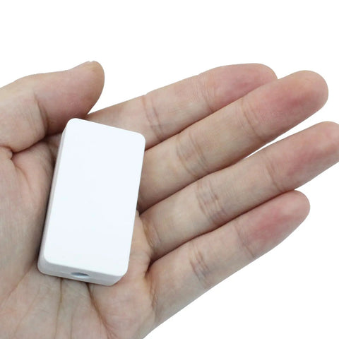 Hand holding a white durable project case from Five Pack Small ABS Plastic Junction Box For Electrical Projects 1.89x1.02x0.59 Inches.