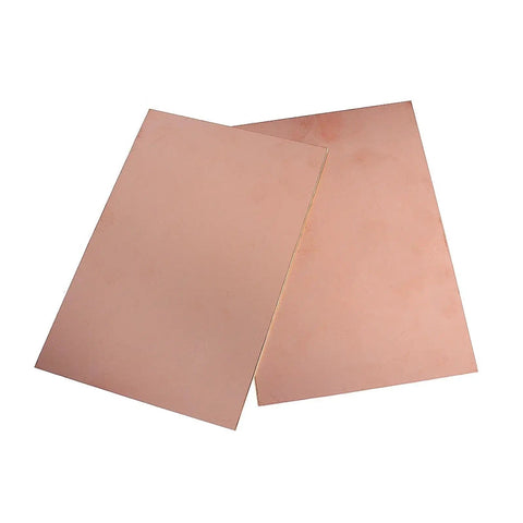 Two single-sided copper clad boards from Five Pack Single Sided FR4 Copper Clad Laminate PCB Kit 7 By 10 Cm Laminate Circuit Boards.