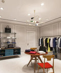 Slick Adjustable LED Recessed Ceiling Lights Featuring 360 Rotation And Solid Stainless Steel Trim illuminating a stylish retail space.