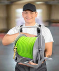 Heavy Duty Stainless Steel Garden Hose Reel Cart With Quick Attach Watering Gun For No Sweat Yard Work And Totally Zero Tangle Storage Game Changer Setup held by a person.