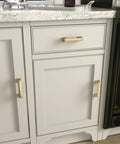 Brushed Gold Cabinet Handles 10 Pack 5 Inch Hole Center Pulls installed on white kitchen cabinets with marble countertop