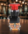 Emergency Stop Button Switch With Red Mushroom Head 22mm NO NC Spring Return on wooden surface, industrial safety device