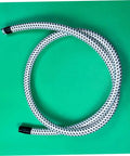 Extended Length PVC Nylon Steam Hose For High Temperature Garment Steamers Replacement Tube coiled on green background.