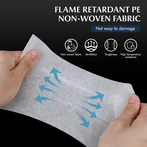 Hands holding Range Hood Filter Sheets Nonwoven Fabric For Grease And Oil Protection Replacement Paper Roll, demonstrating durability.