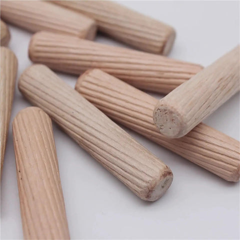 Close-up of wooden dowel pins from Pro Grade Heavy Duty Wooden Dowel Pin Kit 900 Pcs Doweling Jig Set for furniture making.