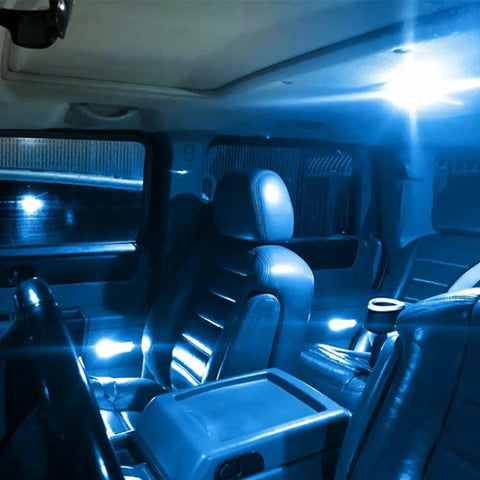 Lit Ice Blue 12V 194 W5W LED Bulb Replacement Kit illuminating car interior with blue light from map dome and courtesy lamps.