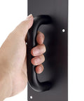 Hand gripping one of two sets 12 inch stainless steel door handles with rust resistant durable black finish, ideal for home office doors.