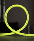 Heavy Duty 3/8 Inch Air Hose 50 Ft Lightweight Hybrid Polymer All Weather Flex From -40 To 140 Degrees Field Repairable Aluminum Fittings Abrasion Resistant Outer Cover Crush Resistant Ends ZillaGreen shown coiled up on a concrete floor.