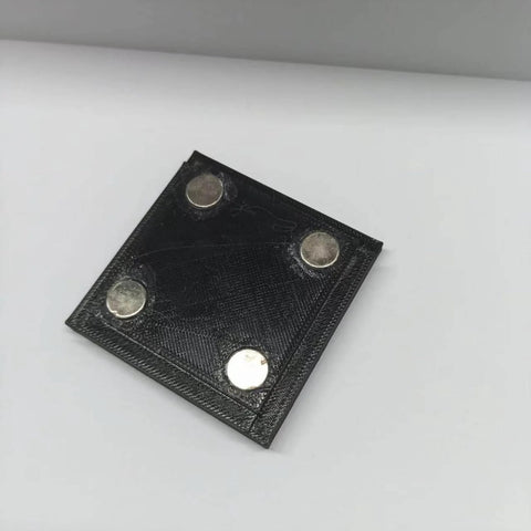 Black square magnetic hold down with four silver magnets, part of the 4 Piece Magnetic Hold Downs For Laser Engravers Rock Solid Magnetic Clamps