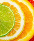 Close-up of sliced citrus fruits including lime, lemon, and grapefruit for Lemon Scent Citrus Multi Surface Cleaner Bulk Pack 4x1 Gallon Jugs