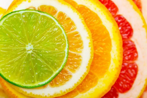 Close-up of sliced citrus fruits including lime, lemon, and grapefruit for Lemon Scent Citrus Multi Surface Cleaner Bulk Pack 4x1 Gallon Jugs
