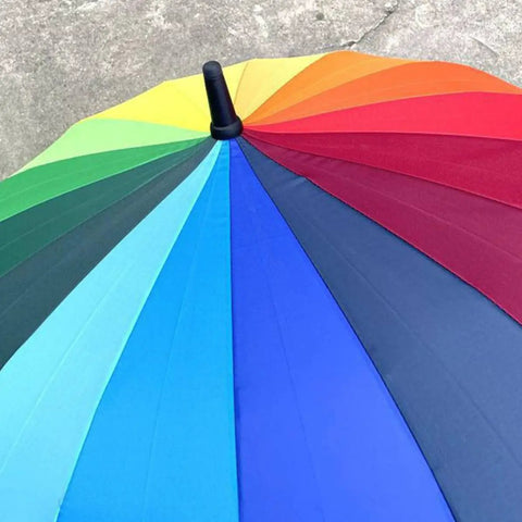 Colorful patio umbrella showing Dead Simple Umbrella Tip Caps 2 Pack Replacement Top Covers For Patio Umbrellas fitting securely.