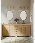 Archie Collection Clear Double Prismatic Glass Coastal Bath Vanity Light Fixture Three Light Vintage Brass Finish in bathroom