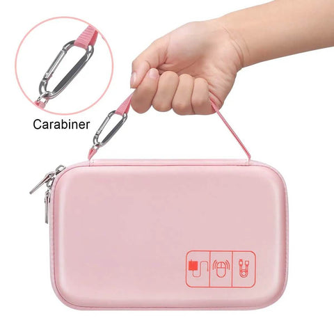 Heavy Duty Travel Electronic Organizer Case With Sleek Cable Pouch For Chargers And Gadgets being held with a carabiner in pink.