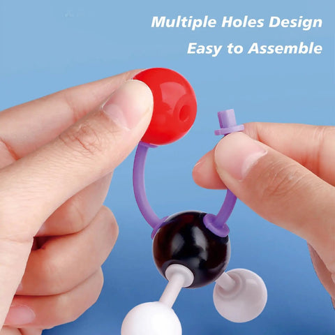 Hands assembling parts of Chemistry Molecular Model Kit with 208 Pieces for Students and Teachers Organic and Inorganic Learning Set to Boost Hands On Science STEM Education and Imagination in the Classroom.