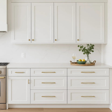 Modern kitchen with white cabinets featuring 1.17 Inch Champagne Bronze Cabinet Knobs Set Of 2, Solid Zinc Alloy, Rust Resistant, Single Hole Mount.