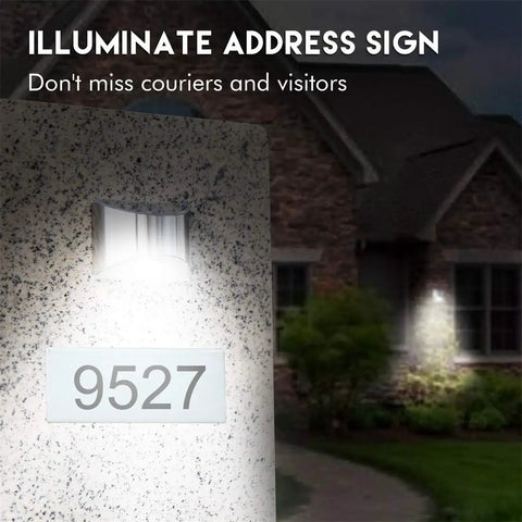 Top Notch Solar Step Lights For Outdoor Fence Deck And Stair Paths Cold White LED post lamp illuminating an address sign on stone wall.