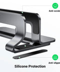 Close-up of a Vertical Laptop Stand For Desk, Aluminum Holder with anti-scratch and anti-slip features, sturdy gray dock.