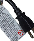 Close-up of black power cord plug with warning label, part of power cord extension and splitter for home office use, 13A 125V.