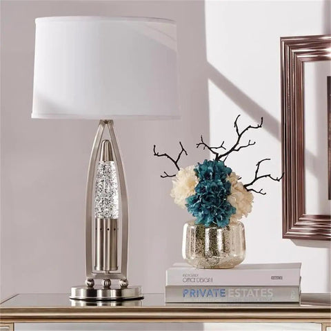 Ultra Modern Table Lamp With Sparkling Water Droplet Dance Night Light, Satin Nickel Finish, on a table in living room