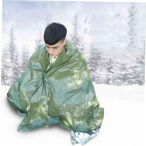 Person wrapped in olive green 3 Pack Thermal Survival Blankets Emergency Kit For Beach Mat Camping Rug Tent Ground Cover Reflective Foil Gear