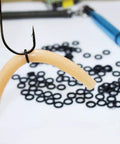 Durable Silicone Wacky Rig O Rings For 4 To 5 Inch Senko Worms Elastic Rings That Prevent Tears Keeps Baits Secure And Let Soft Plastics Fall Naturally Includes 100 Rings And Tackle Box Storage For Easy Fishing Setup. Wacky rig on Senko worm with silicone O-ring