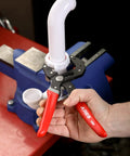 2-Piece Self-Adjusting V-Notch Pliers Set 7-Inch And 10-Inch used on PVC pipe held in blue vise