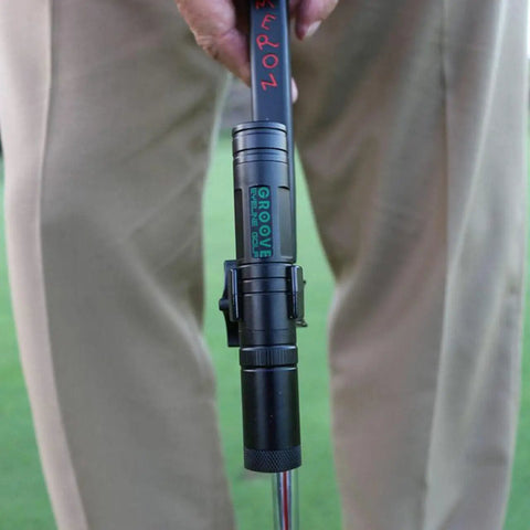 Solid Side Laser Putting Trainer For Righty Golfers Groove Plus Alignment Tool securely attached to golf club for practice.