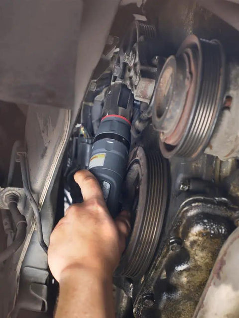 Mechanic using 1207MAX-D3 Three Eighths Inch Drive Air Ratchet Wrench on vehicle engine