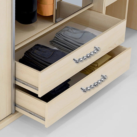 Two 96mm Crystal Glass Cabinet Pulls for kitchen drawers, featuring zinc alloy construction and 7K crystal accents, installed on wooden drawers.