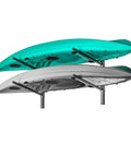 Heavy Duty Wall Mounted Kayak Storage Rack Featuring Adjustable Pads For Two Boats with teal and gray kayaks securely stored.